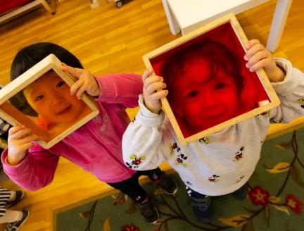 Montessori preschoolers socializing by playing together
