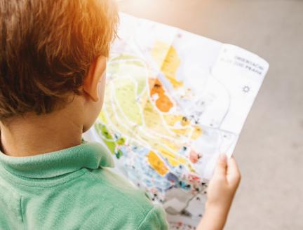 Boy holding a map