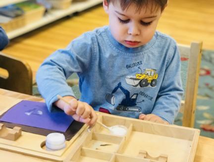 Boy in Montessori preschool