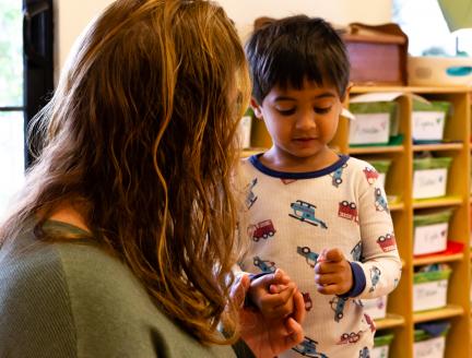Teacher listening to child