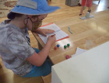 Independent Elementary child in a Montessori classroom in San Diego