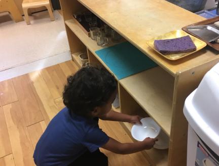 Easy to reach plates for your toddler to help with dinner