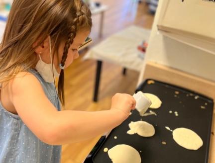 Children at Lifetime Montessori school making breakfast