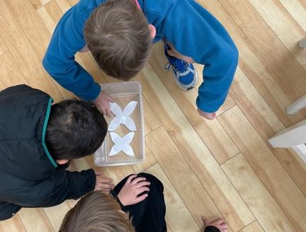 Value of Not Knowing, children in a montessori elementary school solving problems