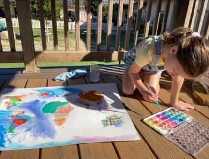 Child independently working outside at Lifetime Montessori school in San Diego
