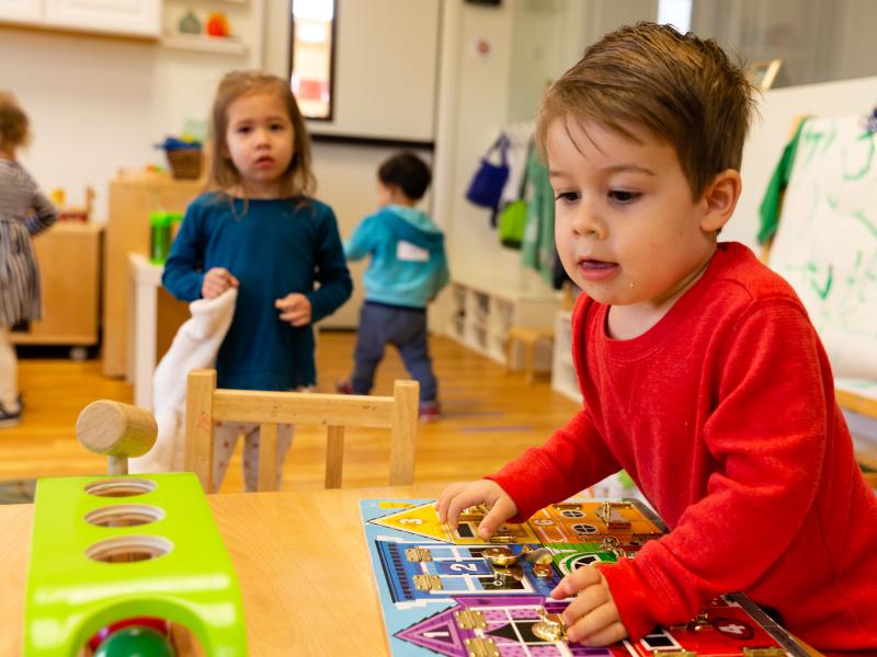 Montessori classroom with children playing and having fun