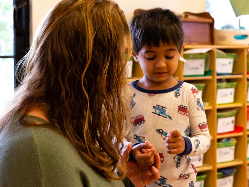 Teacher listening to child