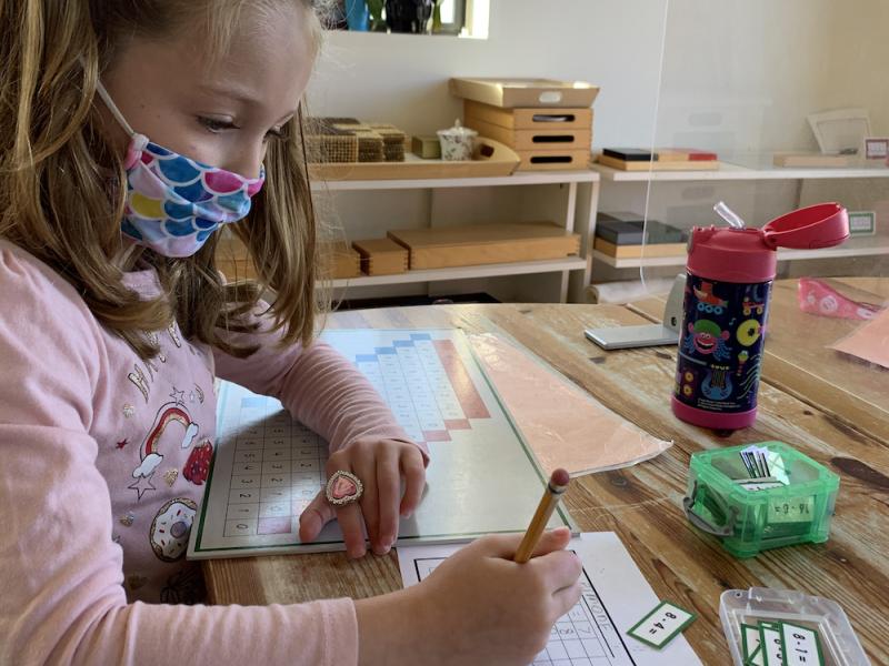 Montessori Primary Student at Lifetime Montessori school doing In-Person Learning