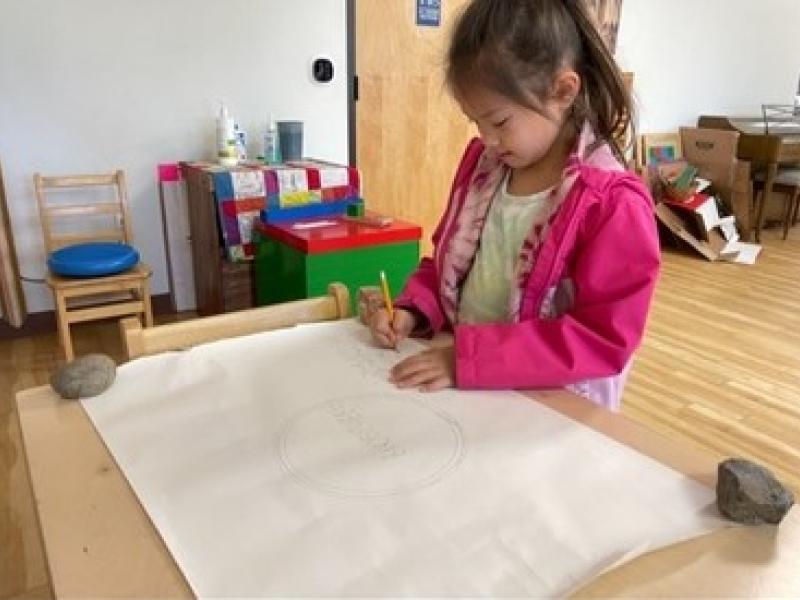 Child independently working in a Montessori Classroom in San Diego