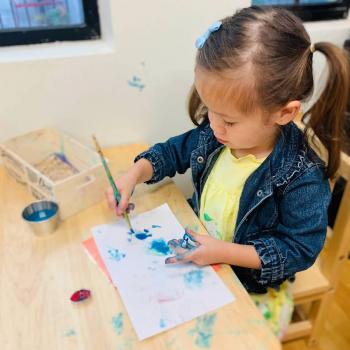 Toddler independently working on art at Lifetime Montessori School 