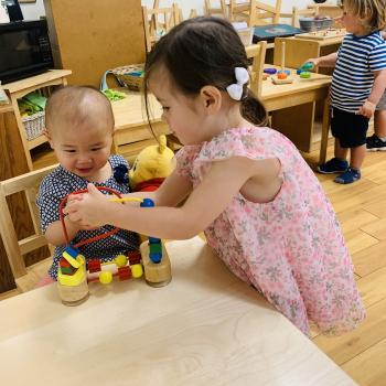 Transitional Kindergarten and toddler working in a blended Montessori classroom at Lifetime Montessori School