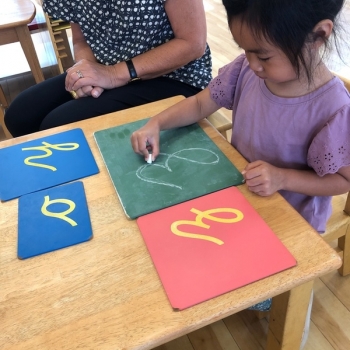 Montessori primary child working at Lifetime Montessori School in San Diego