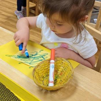 Toddler independently coloring at Lifetime Montessori School 